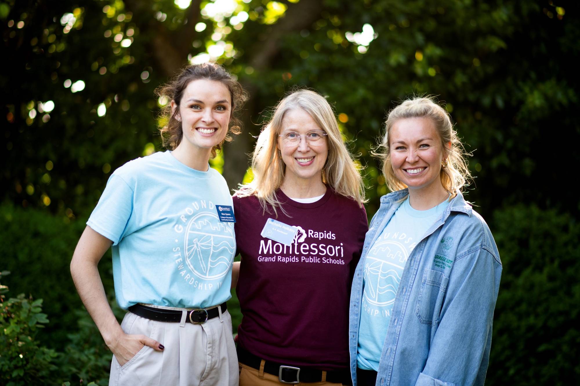 Two Groundswell staff members smiling with a the Groundswell Swell Teacher of the Year